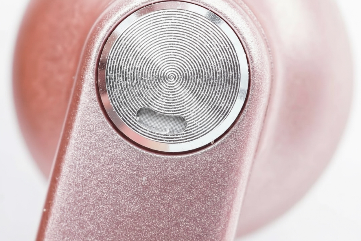 Earbuds exterior with runway-style stem and silver touch disc