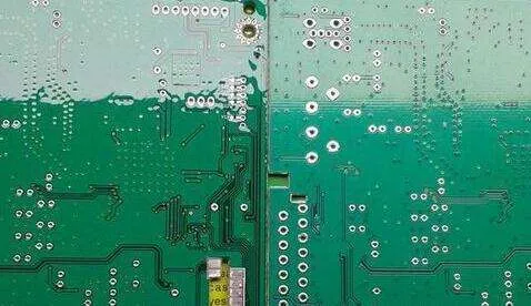 Close-up of PCB with intact conformal coating layer