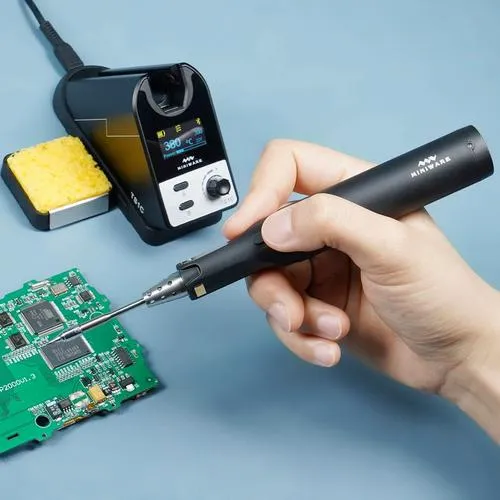 DIY repair of gaming console PCB with soldering iron on capacitor.