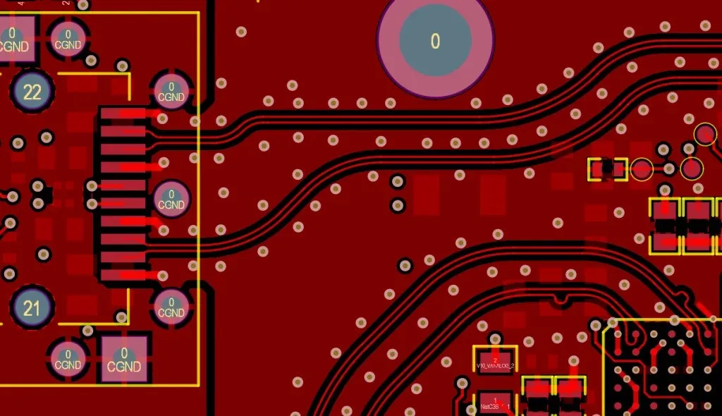 PCB design with stitching vias reducing EMI around a noisy component.