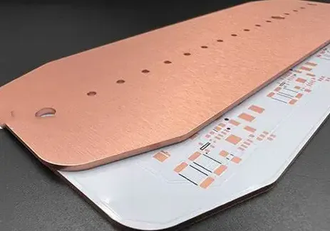 Close-up view of an aluminum PCB showing metal base and copper layers
