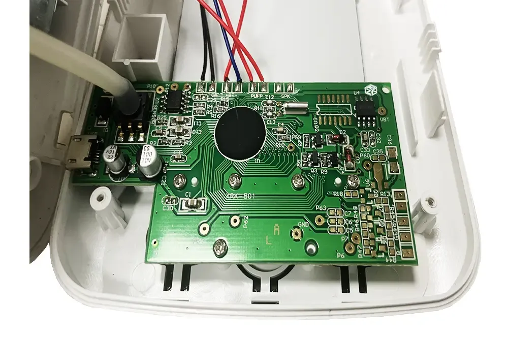 Close-up of blood pressure monitor PCB with sensor integration