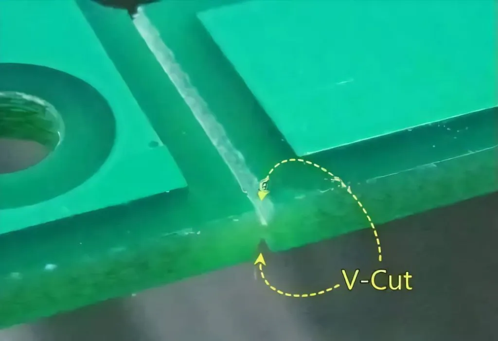 PCB with V-scoring lines for separation.