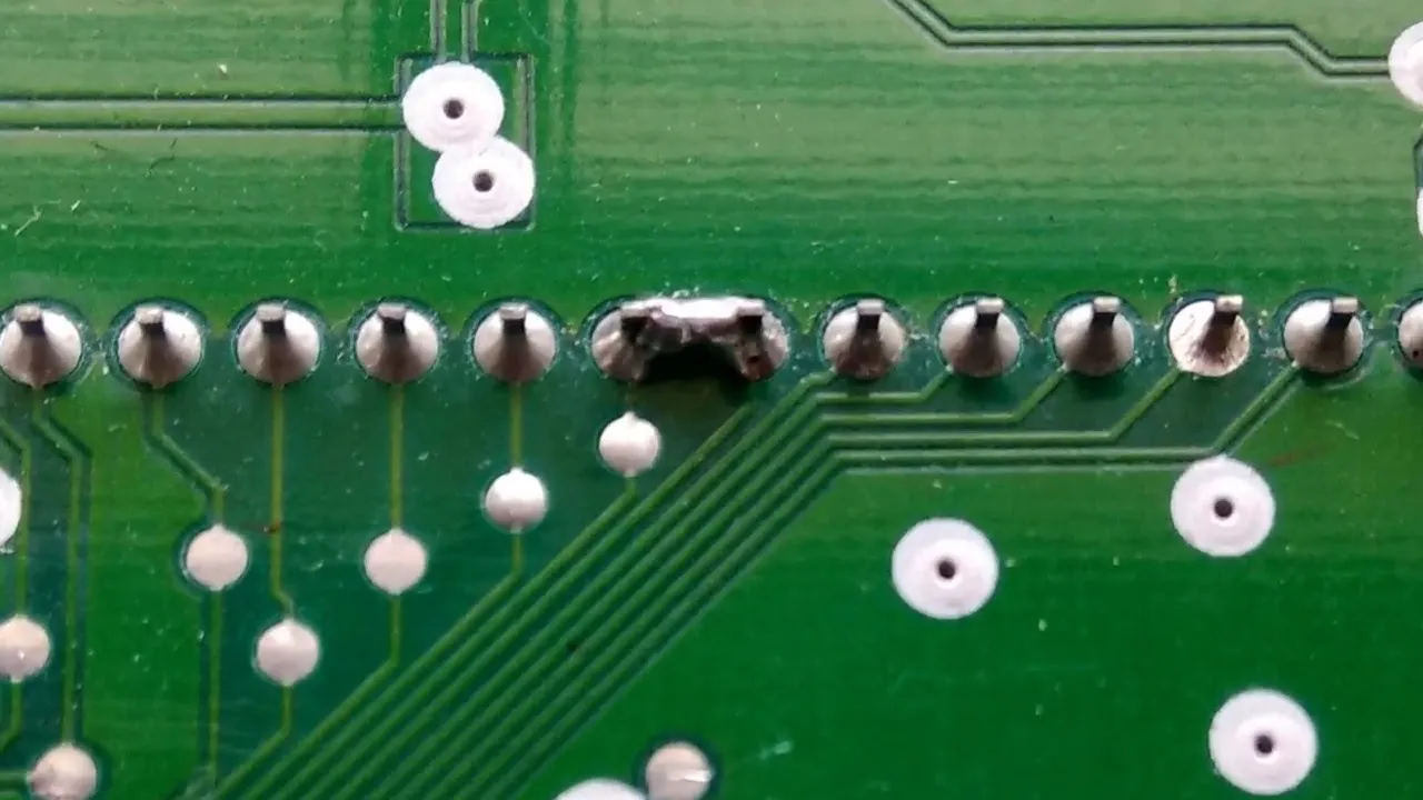 Close-up of PCB solder joints during inspection