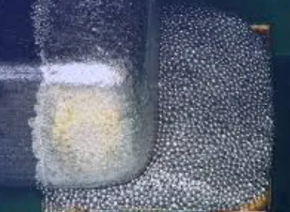 Close-up view of solder paste particles and flux under microscope for rework analysis