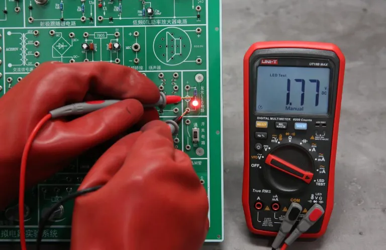 Multimeter testing parking PCB for faults