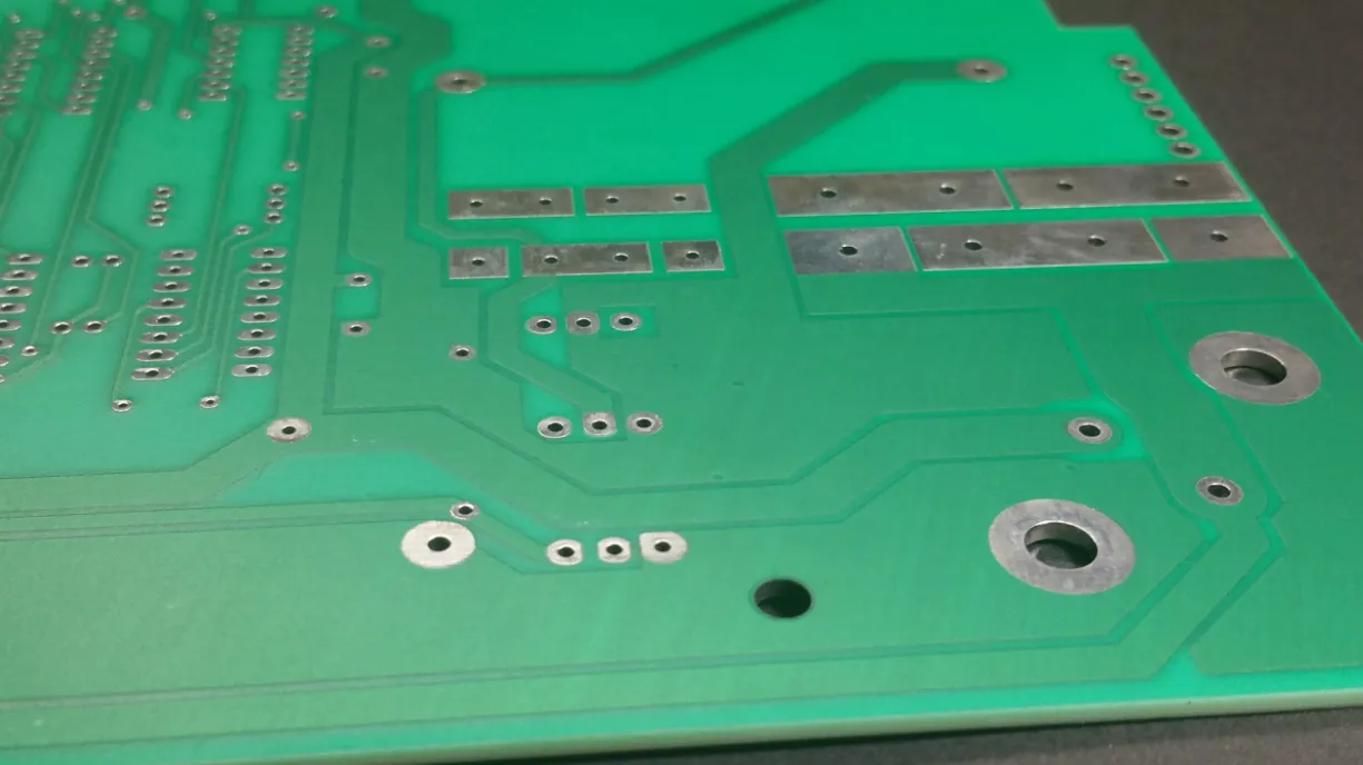 Vintage PCB with green solder mask from early electronics manufacturing