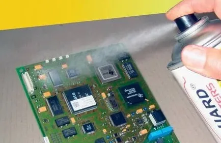 Hobbyist applying conformal coating to PCB using spray method