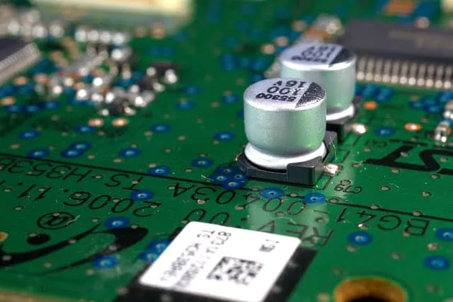 Close-up of PCB with dry film solder mask protecting copper traces.