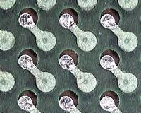 PCB with solder mask misregistration exposing copper near pads