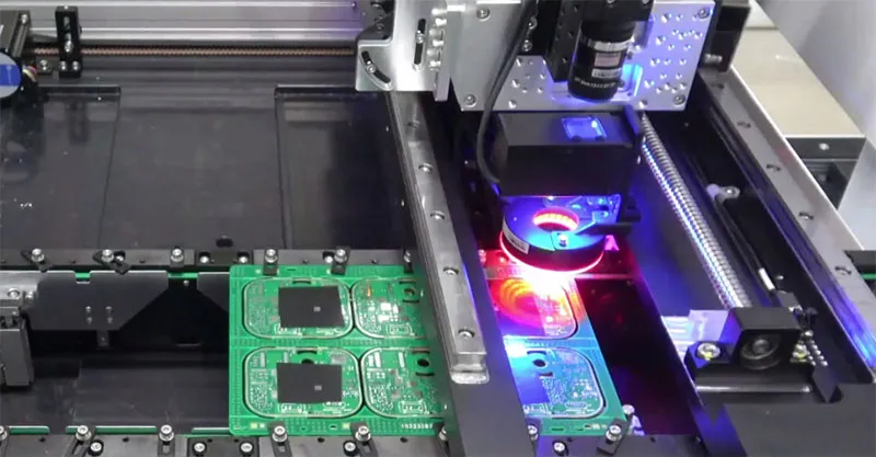 Laser cutting machine precisely shaping a flexible PCB.