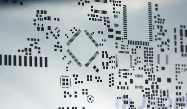 Stainless steel SMT stencil showing surface texture for solder paste transfer