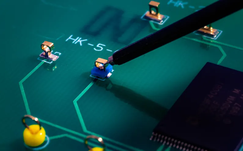 ECU PCB with strategically placed test points for automotive testing.