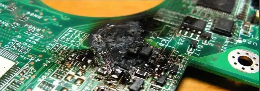 Damaged components on a POS PCB showing signs of failure."
