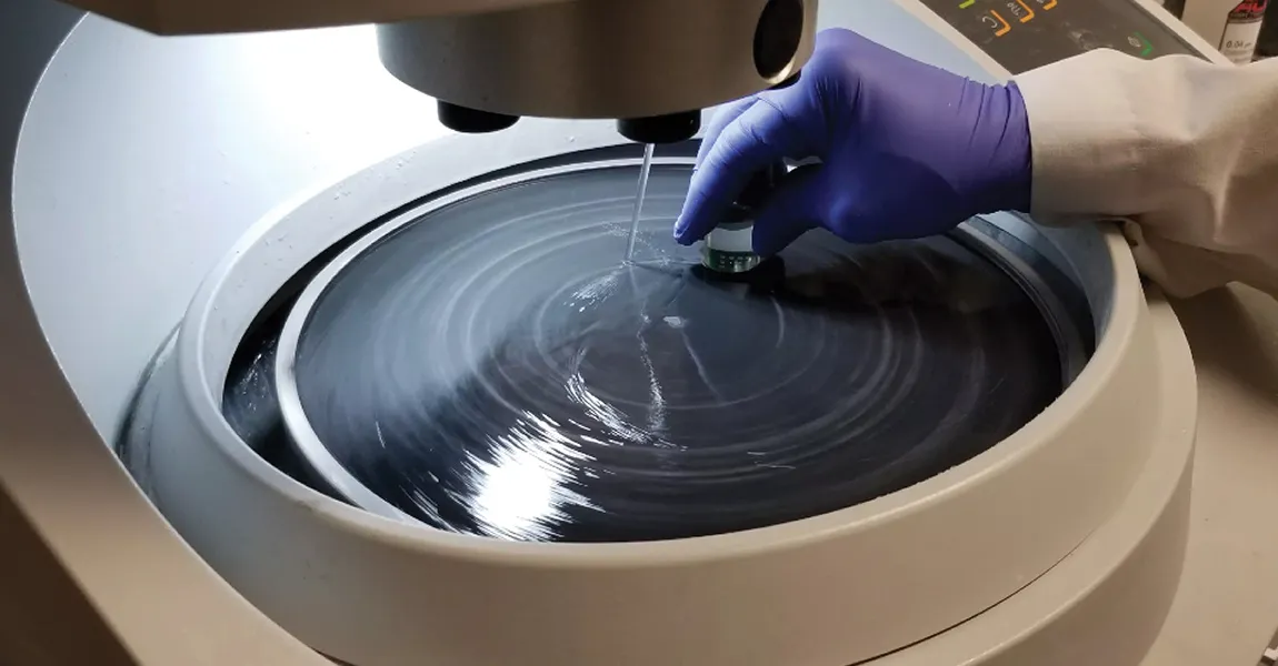 PCB sample being polished for microsectioning analysis