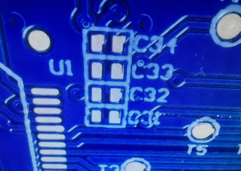 Example of PCB assembly error on bottom layer due to unclear silkscreen.