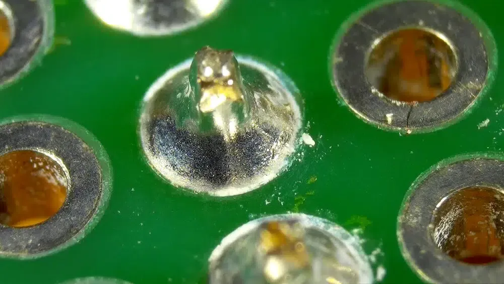 Close-up of SMD PCB with flux residue before cleaning