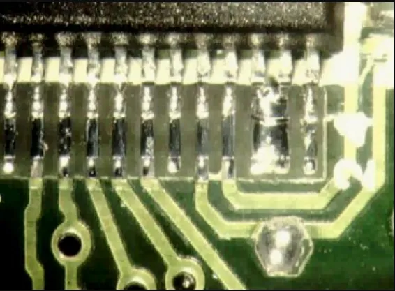 PCB with manufacturing errors like solder bridging
