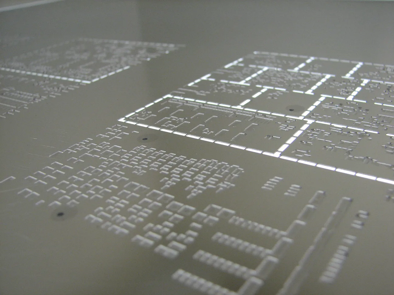 Close-up of solder paste stencil apertures for PCB assembly