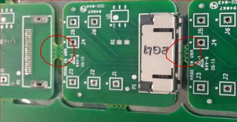 PCB panel with V-scoring and breakaway tabs for stress relief.