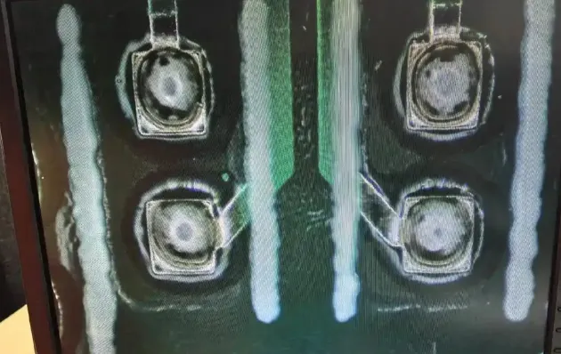 Close-up of solder joint defects on a PCB