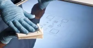 Cleaning a stencil to maintain performance in SMT assembly