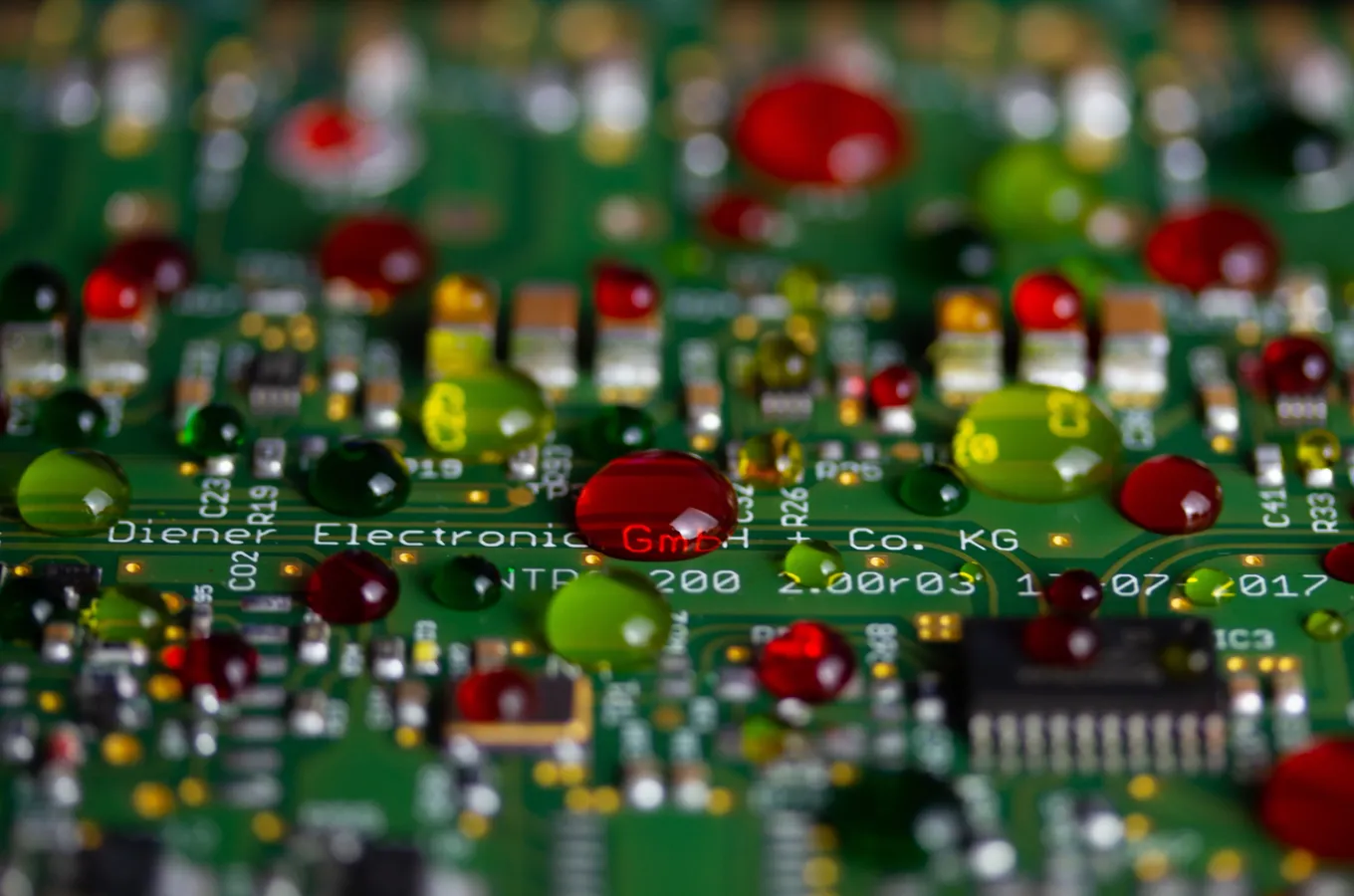 PCB undergoing plasma treatment for ensuring conformal coating adhesion.