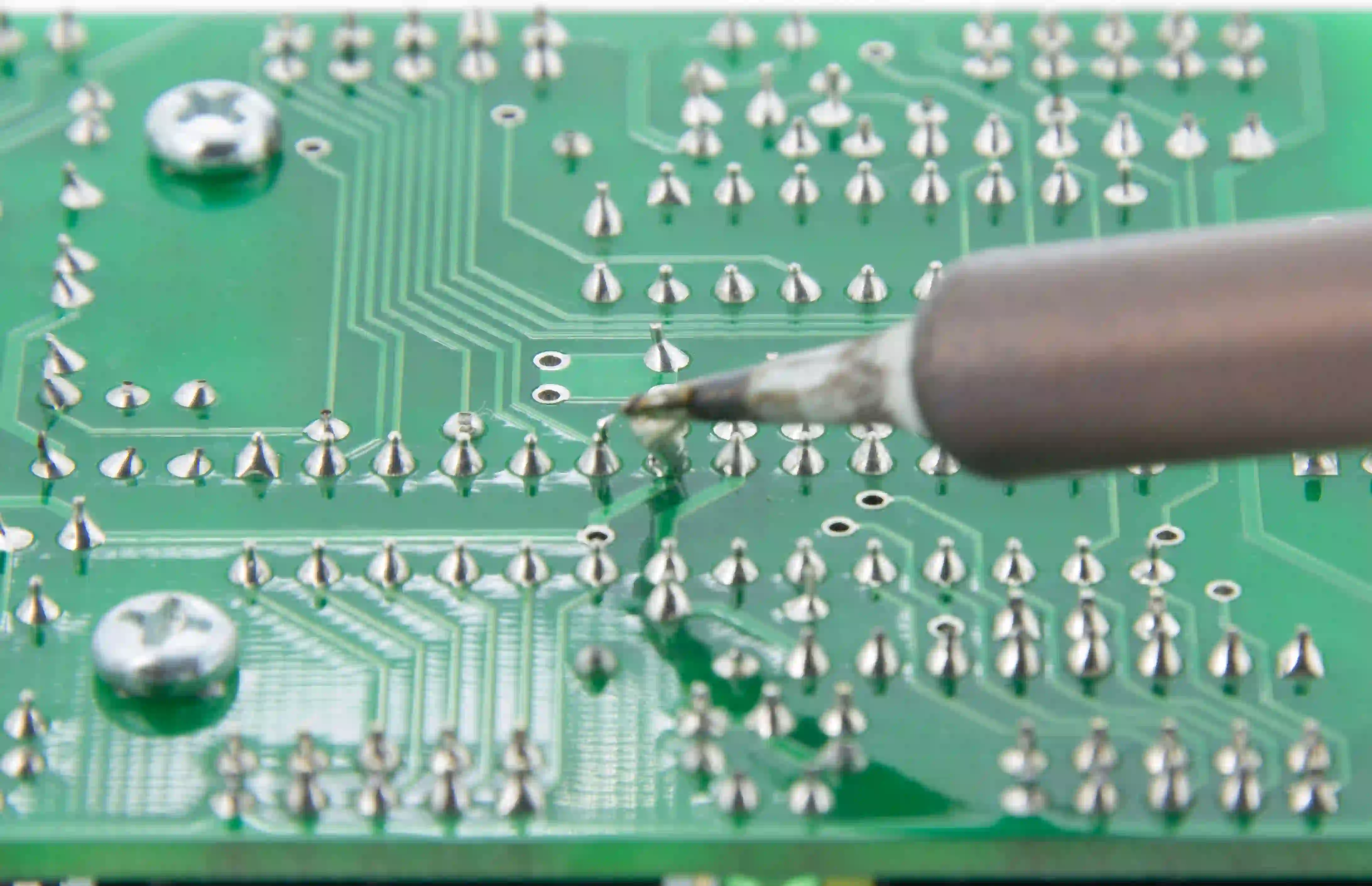 Magnified view of perfect solder joints on a completed PCB