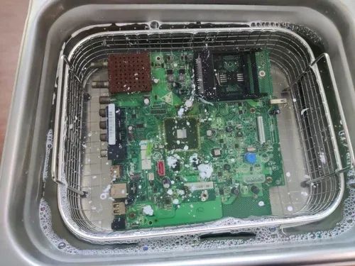 "Ultrasonic cleaning machine for assembled PCB contaminant removal."