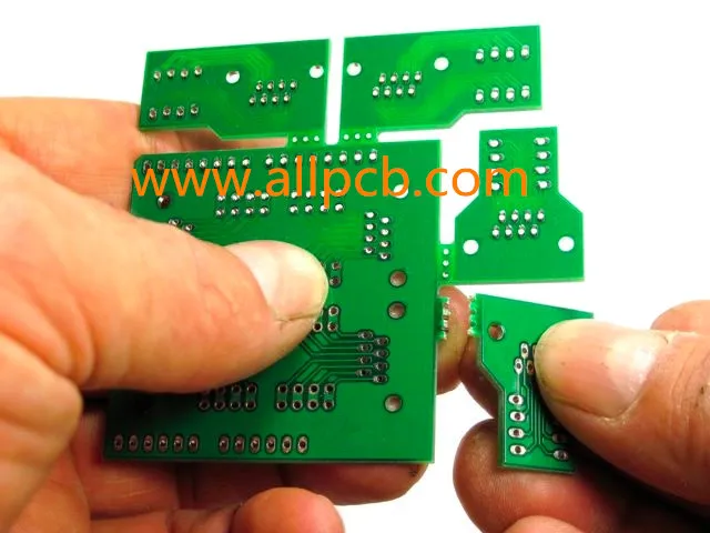 Close-up of mouse bites on a PCB panel for depanelization