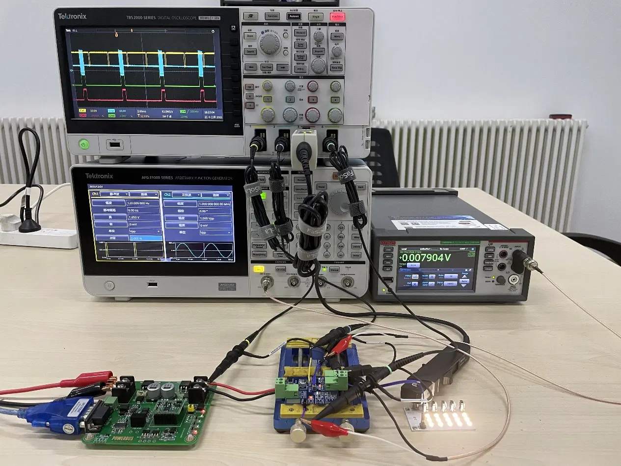 Oscilloscope displaying signal waveform during IC testing on PCB.