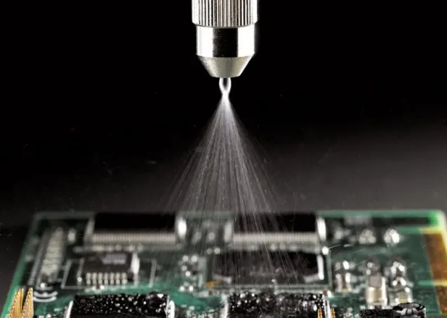 Applying conformal coating with a spray gun at proper distance