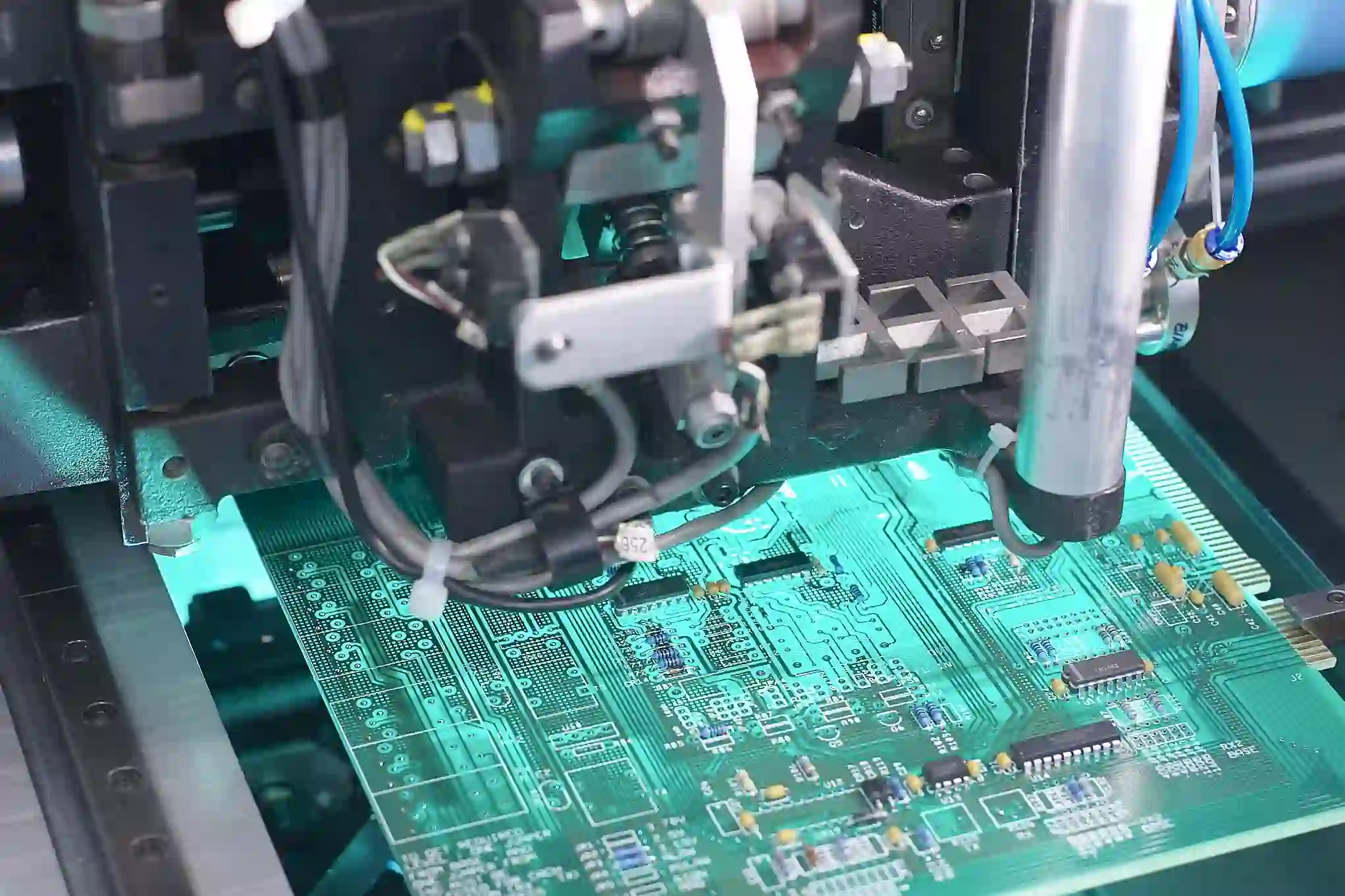 Automated pick-and-place machine mounting components during SMT assembly
