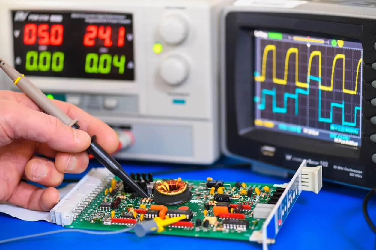 Prototype testing methods using multimeter and oscilloscope on PCB.