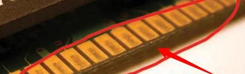Corroded PCB gold finger showing tarnish and pitting on surface