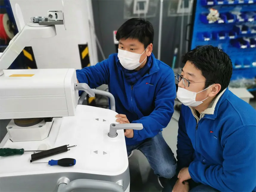 Technician Troubleshooting X-ray Machine