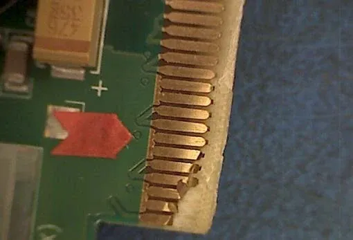 Repaired PCB with restored gold fingers after DIY repair.