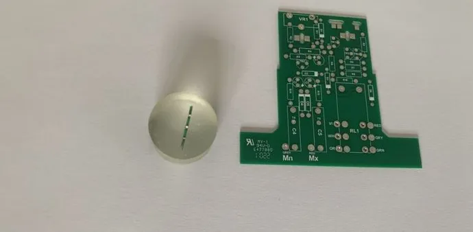Precision cutting saw preparing a PCB sample for microsectioning.