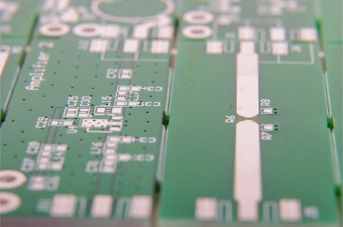 Multiple rectangular PCBs arranged in a panel with V-scoring lines