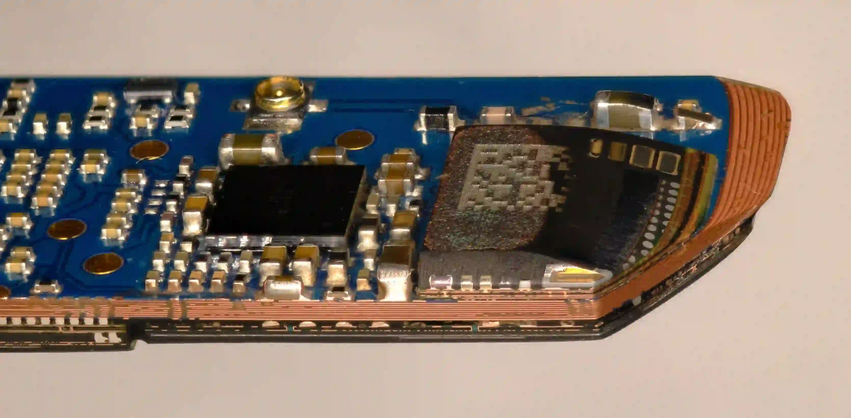 Cross-section of multilayer PCB showing complex trace routing and vias.