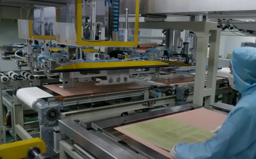 PCB manufacturing facility showing etching and lamination processes.