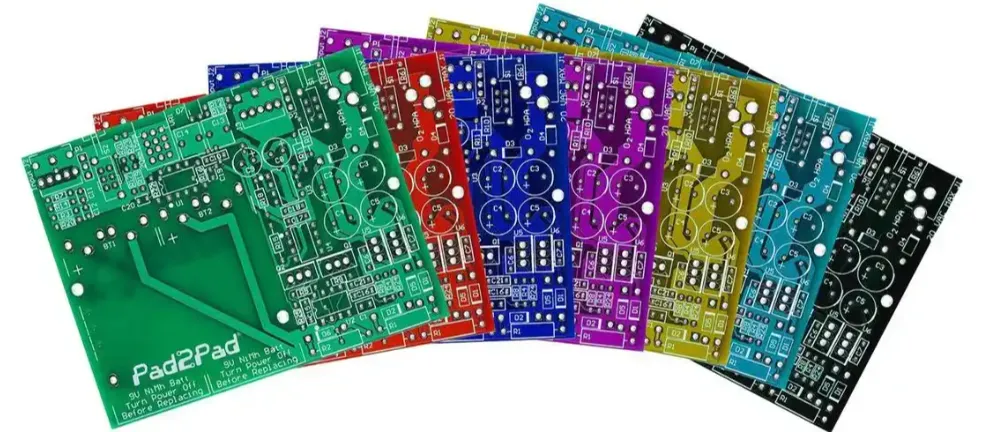 Collection of PCBs with green, black, and red solder masks for comparison.