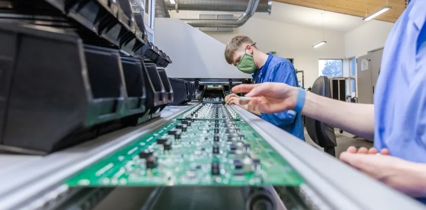 Wave soldering process for through-hole components on a double-sided PCB
