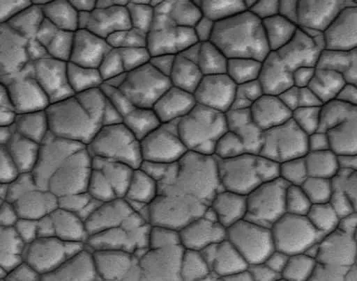 Microscopic view of ENIG black pad defect on PCB surface.