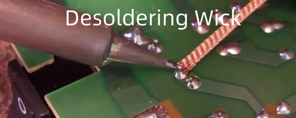 "Desoldering tools removing solder from PCB"