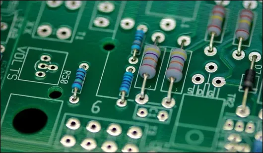 PCB with thru-holes used for component mounting.
