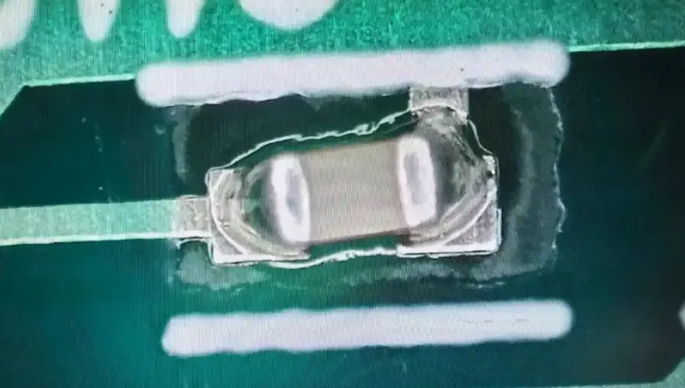 Example of a solder bridge defect on a PCB