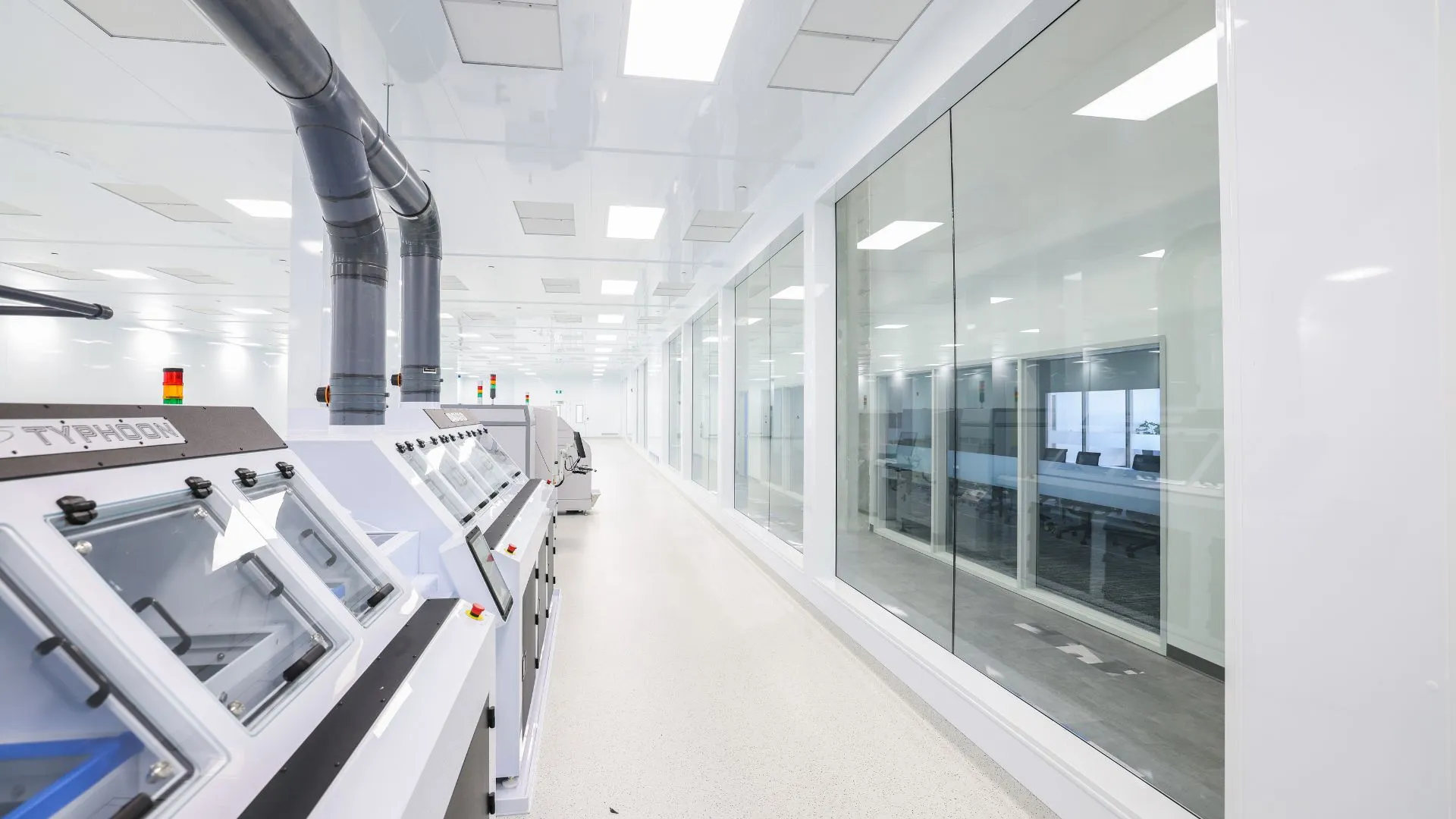 Operator in cleanroom attire during stencil printing for contamination control