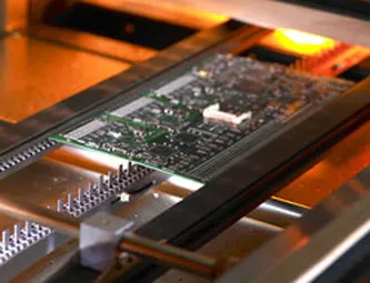 Solder reflow oven with PCB during soldering process
