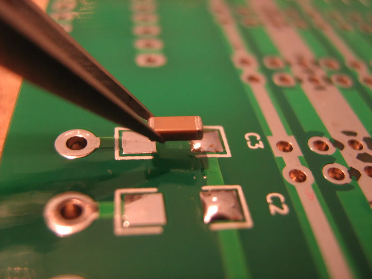 Newly soldered SMD resistor on a cleaned PCB